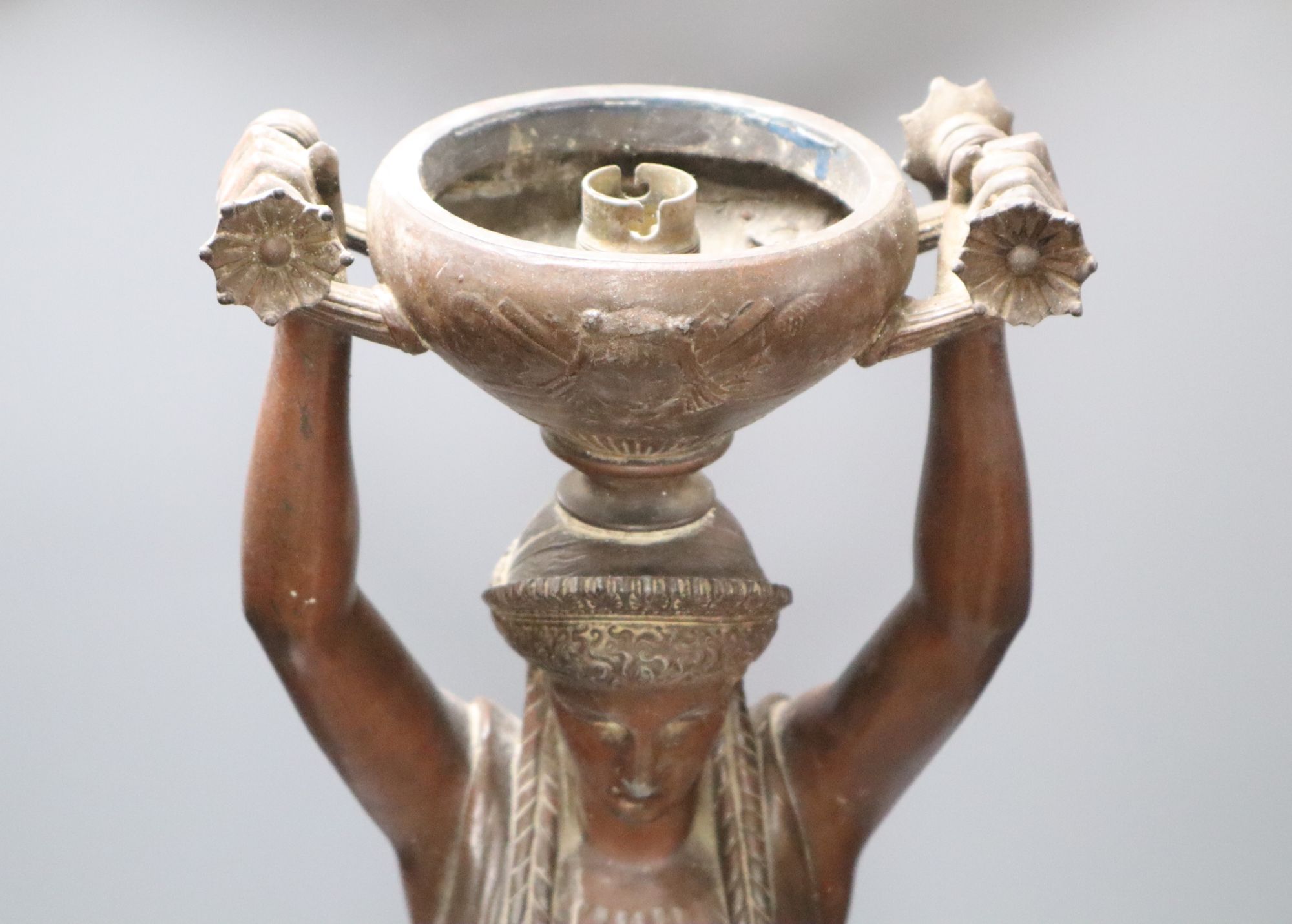 A pair of spelter cherubs, after Bruchon, and another spelter figure, height 74cm